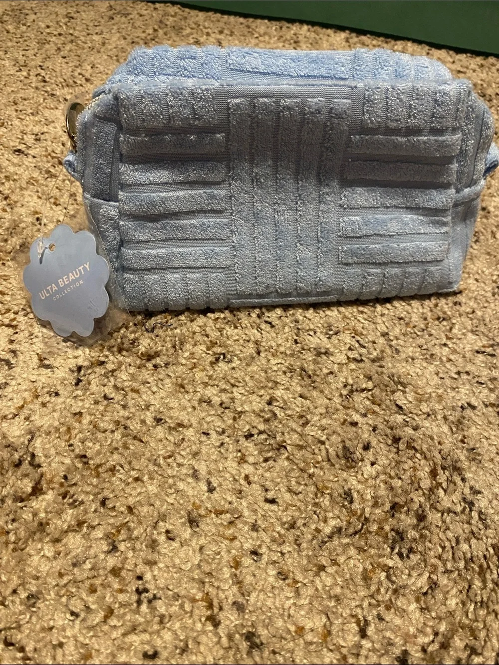 Ulta Beauty Light Blue Terry Textured Cosmetic Case with eye makeup
